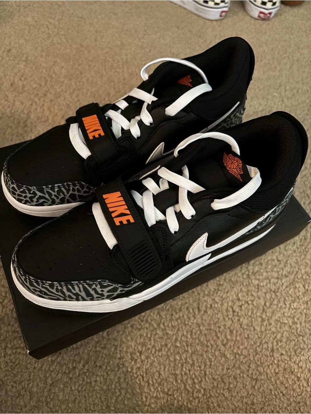 Jordan Legacy 312 Low (GS) Black White Grey with orange accents